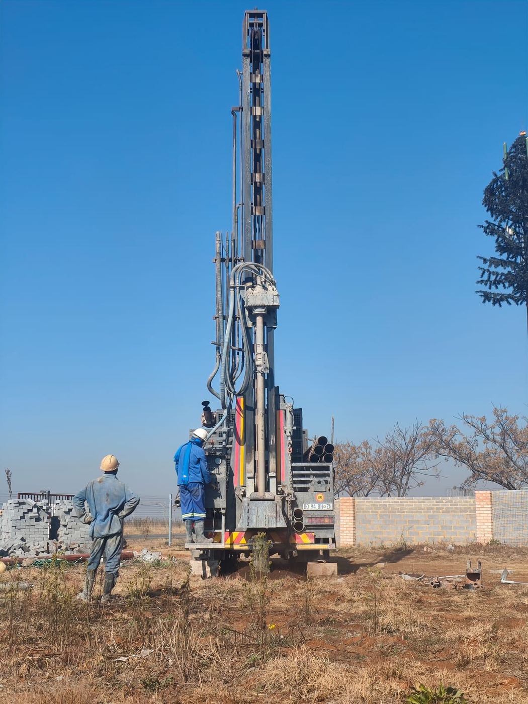 Drilling rig with crew on site