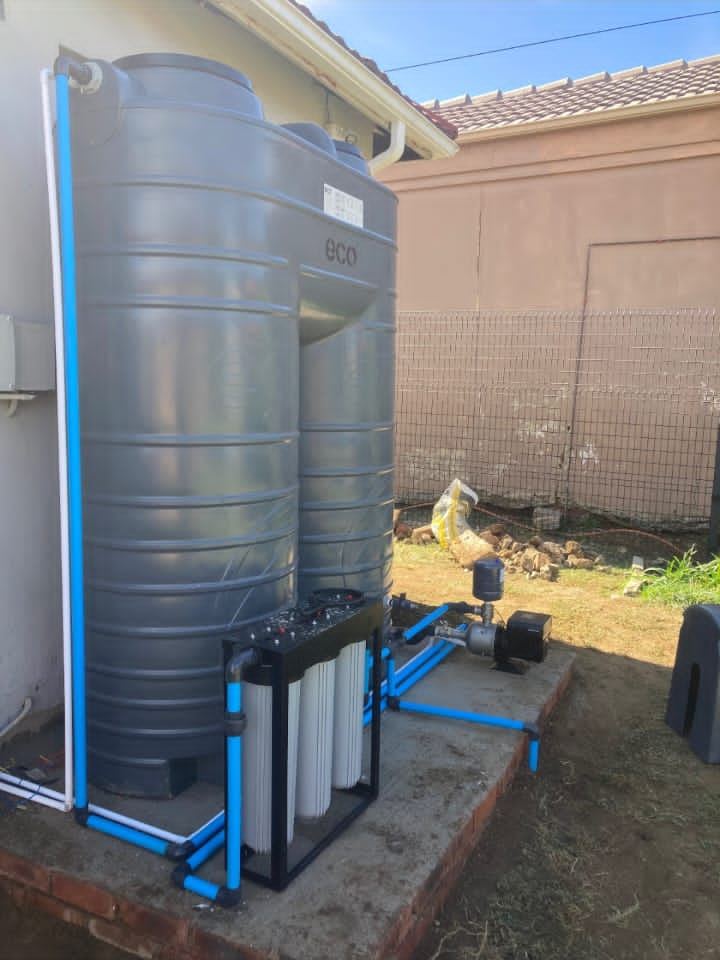 Water tank with pump and pipework