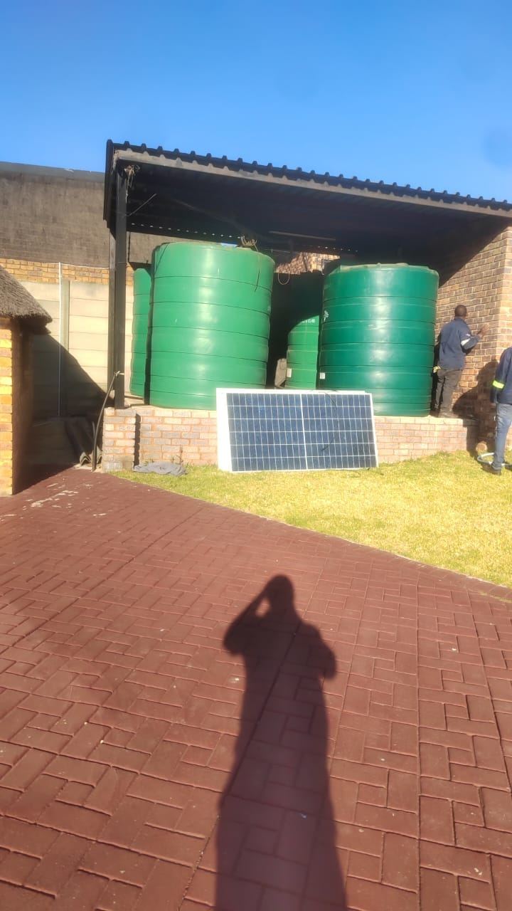 Green water tanks with a solar panel